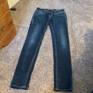 Buckle black skinny jeans